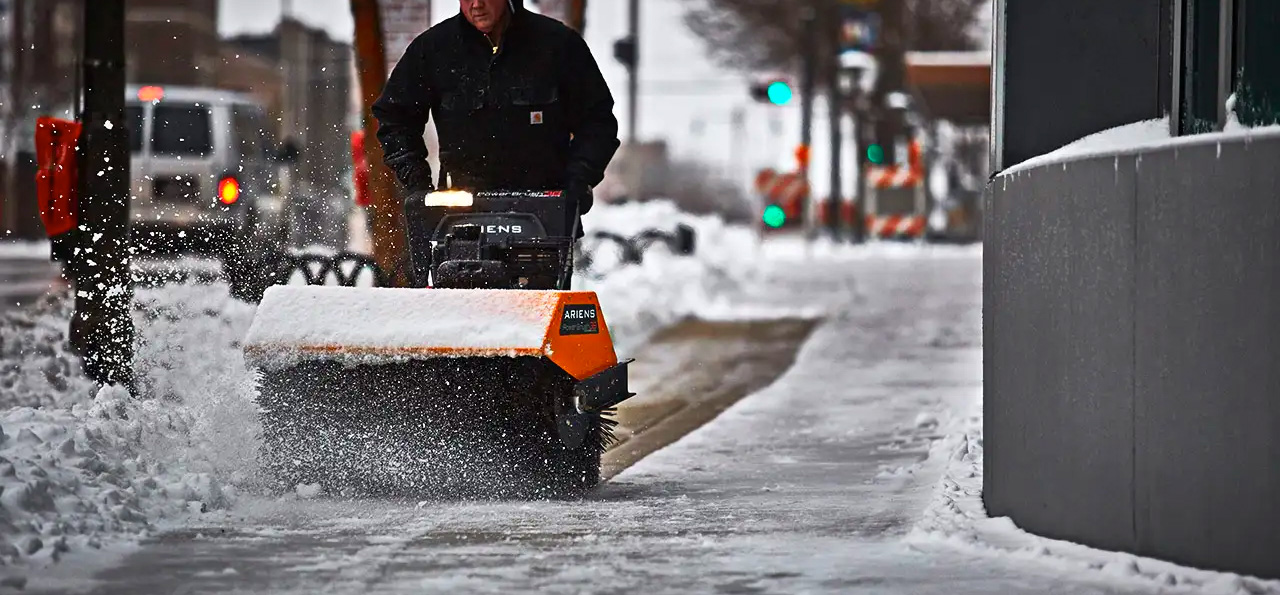 Ariens Power Brush on Sidewalk